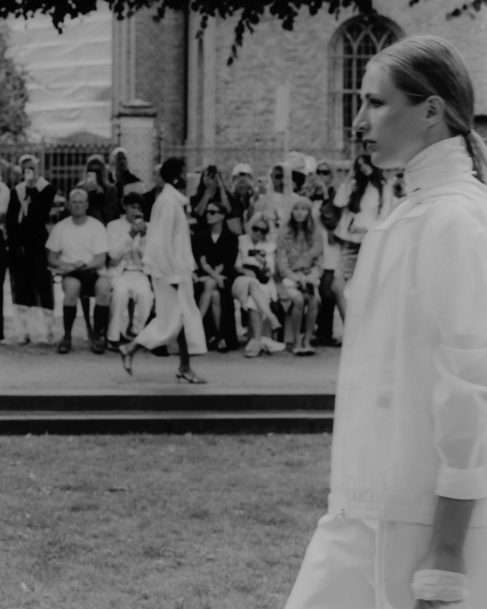 MKDT Studio SS27 runway looks – bucket hat with wild grasses and white collar in profile