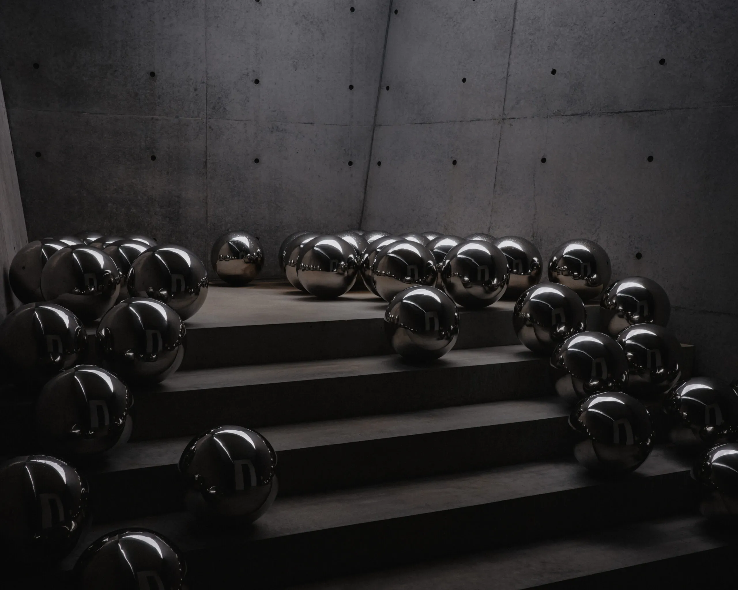 Mirrored spheres resting on concrete steps